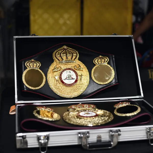 A WBA championship belt displayed in an open case on the Braswell Law table
