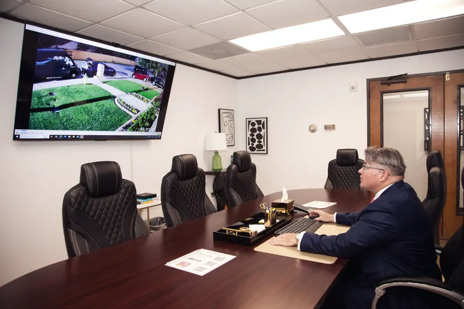Mark Braswell at the head of the conference table in the firm's office